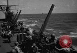 Image of USS Minneapolis (CA-36) firing guns in battle for  Wake Island Pacific Theater, 1942, second 27 stock footage video 65675049022