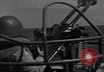 Image of Sailor mans twin 50 caliber machine gun in U.S. PT boat Atlantic Ocean, 1944, second 1 stock footage video 65675049225