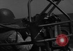 Image of Sailor mans twin 50 caliber machine gun in U.S. PT boat Atlantic Ocean, 1944, second 5 stock footage video 65675049225
