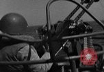 Image of Sailor mans twin 50 caliber machine gun in U.S. PT boat Atlantic Ocean, 1944, second 6 stock footage video 65675049225