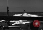 Image of Sailor mans twin 50 caliber machine gun in U.S. PT boat Atlantic Ocean, 1944, second 19 stock footage video 65675049225