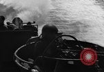 Image of Sailor mans twin 50 caliber machine gun in U.S. PT boat Atlantic Ocean, 1944, second 24 stock footage video 65675049225