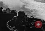 Image of Sailor mans twin 50 caliber machine gun in U.S. PT boat Atlantic Ocean, 1944, second 25 stock footage video 65675049225