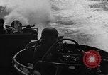 Image of Sailor mans twin 50 caliber machine gun in U.S. PT boat Atlantic Ocean, 1944, second 27 stock footage video 65675049225
