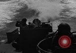 Image of Sailor mans twin 50 caliber machine gun in U.S. PT boat Atlantic Ocean, 1944, second 35 stock footage video 65675049225