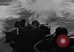 Image of Sailor mans twin 50 caliber machine gun in U.S. PT boat Atlantic Ocean, 1944, second 37 stock footage video 65675049225