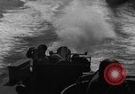 Image of Sailor mans twin 50 caliber machine gun in U.S. PT boat Atlantic Ocean, 1944, second 39 stock footage video 65675049225