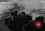 Image of Sailor mans twin 50 caliber machine gun in U.S. PT boat Atlantic Ocean, 1944, second 40 stock footage video 65675049225