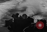 Image of Sailor mans twin 50 caliber machine gun in U.S. PT boat Atlantic Ocean, 1944, second 42 stock footage video 65675049225