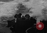Image of Sailor mans twin 50 caliber machine gun in U.S. PT boat Atlantic Ocean, 1944, second 43 stock footage video 65675049225