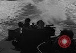 Image of Sailor mans twin 50 caliber machine gun in U.S. PT boat Atlantic Ocean, 1944, second 45 stock footage video 65675049225