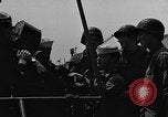 Image of U.S. soldiers ask Coast Guardsmen about 20mm antiaircraft gun Weymouth England United Kingdom, 1944, second 15 stock footage video 65675049228