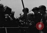 Image of U.S. soldiers ask Coast Guardsmen about 20mm antiaircraft gun Weymouth England United Kingdom, 1944, second 19 stock footage video 65675049228