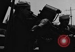 Image of U.S. soldiers ask Coast Guardsmen about 20mm antiaircraft gun Weymouth England United Kingdom, 1944, second 27 stock footage video 65675049228