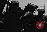 Image of U.S. soldiers ask Coast Guardsmen about 20mm antiaircraft gun Weymouth England United Kingdom, 1944, second 28 stock footage video 65675049228