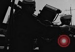 Image of U.S. soldiers ask Coast Guardsmen about 20mm antiaircraft gun Weymouth England United Kingdom, 1944, second 33 stock footage video 65675049228