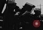 Image of U.S. soldiers ask Coast Guardsmen about 20mm antiaircraft gun Weymouth England United Kingdom, 1944, second 38 stock footage video 65675049228