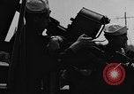 Image of U.S. soldiers ask Coast Guardsmen about 20mm antiaircraft gun Weymouth England United Kingdom, 1944, second 39 stock footage video 65675049228
