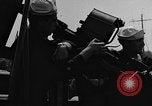 Image of U.S. soldiers ask Coast Guardsmen about 20mm antiaircraft gun Weymouth England United Kingdom, 1944, second 40 stock footage video 65675049228