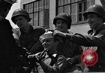 Image of U.S. soldiers ask Coast Guardsmen about 20mm antiaircraft gun Weymouth England United Kingdom, 1944, second 43 stock footage video 65675049228
