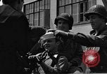 Image of U.S. soldiers ask Coast Guardsmen about 20mm antiaircraft gun Weymouth England United Kingdom, 1944, second 44 stock footage video 65675049228