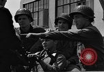 Image of U.S. soldiers ask Coast Guardsmen about 20mm antiaircraft gun Weymouth England United Kingdom, 1944, second 46 stock footage video 65675049228