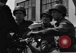 Image of U.S. soldiers ask Coast Guardsmen about 20mm antiaircraft gun Weymouth England United Kingdom, 1944, second 47 stock footage video 65675049228