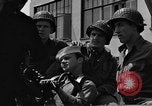 Image of U.S. soldiers ask Coast Guardsmen about 20mm antiaircraft gun Weymouth England United Kingdom, 1944, second 52 stock footage video 65675049228