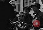 Image of U.S. soldiers ask Coast Guardsmen about 20mm antiaircraft gun Weymouth England United Kingdom, 1944, second 53 stock footage video 65675049228