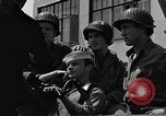 Image of U.S. soldiers ask Coast Guardsmen about 20mm antiaircraft gun Weymouth England United Kingdom, 1944, second 54 stock footage video 65675049228