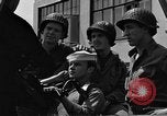 Image of U.S. soldiers ask Coast Guardsmen about 20mm antiaircraft gun Weymouth England United Kingdom, 1944, second 56 stock footage video 65675049228