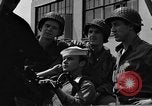 Image of U.S. soldiers ask Coast Guardsmen about 20mm antiaircraft gun Weymouth England United Kingdom, 1944, second 57 stock footage video 65675049228