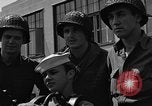 Image of U.S. soldiers ask Coast Guardsmen about 20mm antiaircraft gun Weymouth England United Kingdom, 1944, second 59 stock footage video 65675049228