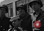 Image of U.S. soldiers ask Coast Guardsmen about 20mm antiaircraft gun Weymouth England United Kingdom, 1944, second 62 stock footage video 65675049228