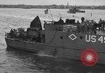 Image of U.S. landing craft  leave England for Invasion of Normandy, France, in Weymouth England United Kingdom, 1944, second 60 stock footage video 65675049231