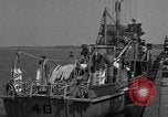 Image of Crew of USS Pilot AM-104 deploys and retrieves cables Chesapeake Bay, 1939, second 9 stock footage video 65675049270