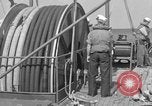 Image of Crew of USS Pilot AM-104 deploys and retrieves cables Chesapeake Bay, 1939, second 52 stock footage video 65675049270