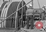 Image of Crew of USS Pilot AM-104 deploys and retrieves cables Chesapeake Bay, 1939, second 53 stock footage video 65675049270