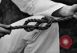 Image of knot tying and flag semaphore Connecticut USA, 1935, second 26 stock footage video 65675049560