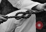 Image of knot tying and flag semaphore Connecticut USA, 1935, second 27 stock footage video 65675049560