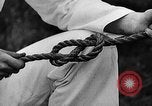 Image of knot tying and flag semaphore Connecticut USA, 1935, second 28 stock footage video 65675049560