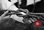 Image of knot tying and flag semaphore Connecticut USA, 1935, second 32 stock footage video 65675049560