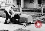 Image of Homemade car of newspaper boy Edward Floyd Seattle Washington USA, 1933, second 22 stock footage video 65675049746