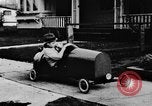 Image of Homemade car of newspaper boy Edward Floyd Seattle Washington USA, 1933, second 27 stock footage video 65675049746