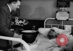 Image of Adolf Hitler visits July 20th bomb plot victims in hospital Rastenburg Germany, 1944, second 14 stock footage video 65675049858