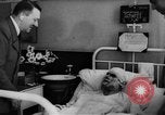 Image of Adolf Hitler visits July 20th bomb plot victims in hospital Rastenburg Germany, 1944, second 15 stock footage video 65675049858