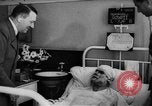 Image of Adolf Hitler visits July 20th bomb plot victims in hospital Rastenburg Germany, 1944, second 16 stock footage video 65675049858