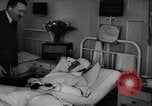 Image of Adolf Hitler visits July 20th bomb plot victims in hospital Rastenburg Germany, 1944, second 31 stock footage video 65675049858