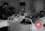 Image of Adolf Hitler visits July 20th bomb plot victims in hospital Rastenburg Germany, 1944, second 42 stock footage video 65675049858