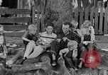 Image of man under a tree Kentucky United States USA, 1940, second 4 stock footage video 65675050028